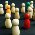 Small wooden figures. Social inclusion, diversity and equality concept.